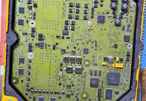 Opened ECM circuit board for repair and testing
